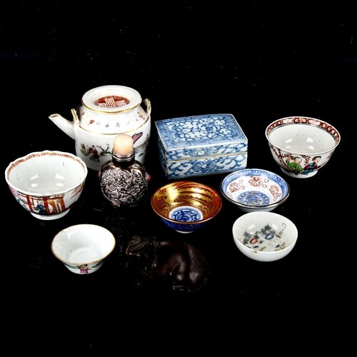 A group of Oriental items, including porcelain tea bowls, un...