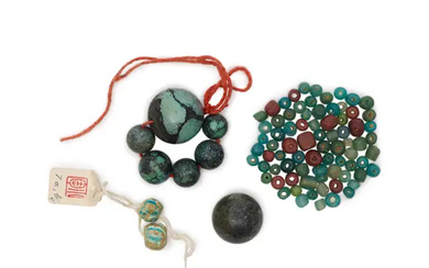 A group of blue-coloured beads Containing six turquoise beads, a mottled greyish...