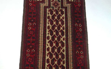 A handwoven Turkish prayer rug, the multi line border surrounding...