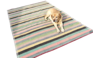 A large kilim woven with candy coloured stripes, having...