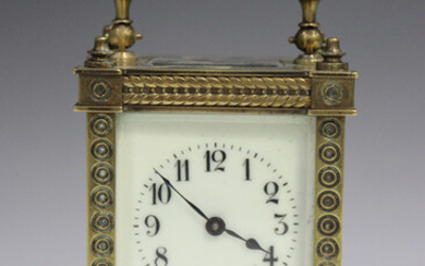 A late 19th/early 20th century lacquered brass carriage timepiece with eight day movement, the dial