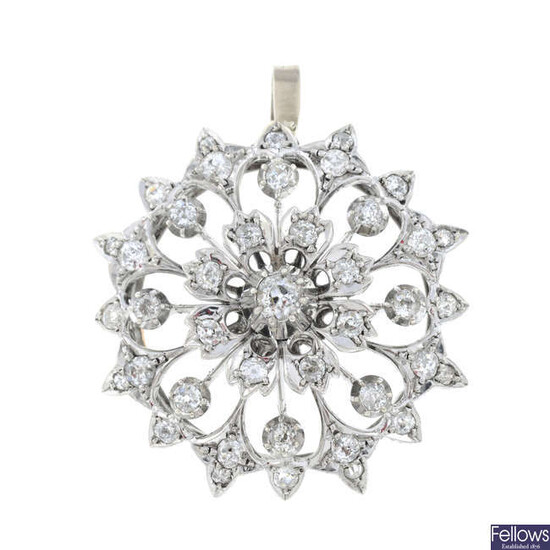 A late Victorian silver and gold, circular-cut diamond floral pendant.