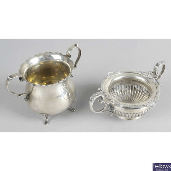 A late Victorian silver small twin-handled bowl, together with an early George V example. (2).