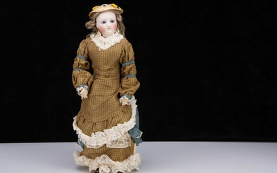 A late late 19th century French pressed bisque swivel-head fashionable doll on Gesland body