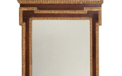 A mahogany and parcel gilt wood wall mirror