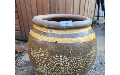 A nicely glazed terracotta plant pot with dragon decoration....