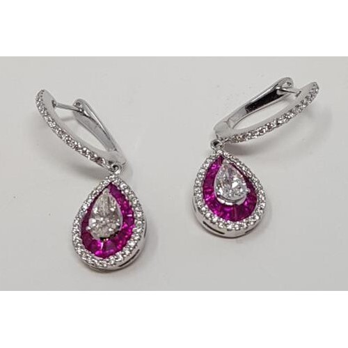 A pair of 18ct white gold, ruby and diamond pear shaped drop...