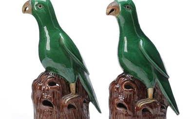 SOLD. A pair of Chinese 20th c. emaille sur bisquit parrots. H. 29 cm. Wooden stands included. (2) – Bruun Rasmussen Auctioneers of Fine Art