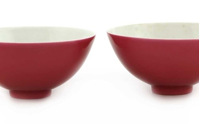 A pair of Chinese ruby-enamelled tea bowls