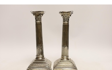 A pair of Edwardian silver Corinthian column candlesticks, b...