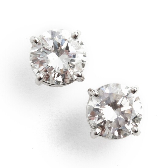 A pair of diamond ear studs each set with a brilliant-cut diamond weighing a total of app. 1.98 ct., mounted in 18k white gold. I/SI-P1. (2)
