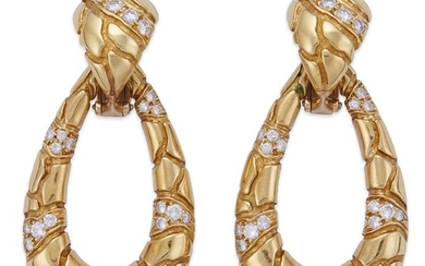 A pair of eighteen karat gold and diamond earrings...