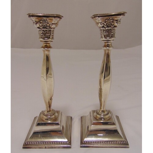 A pair of hallmarked silver table candlesticks, faceted balu...