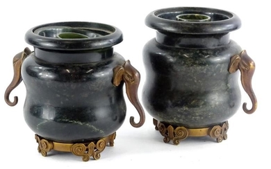 A pair of hardstone vases, with elephant mask handles...