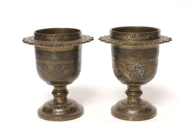 A pair of late 19th century Indian brass vases, 12cm high...