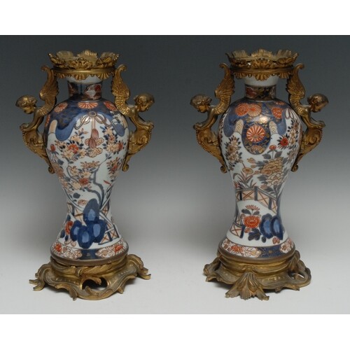 A pair of ormolu mounted 17th century Japanese baluster vase...