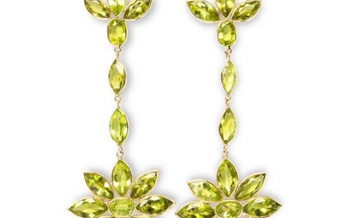A pair of peridot and fourteen karat gold earrings