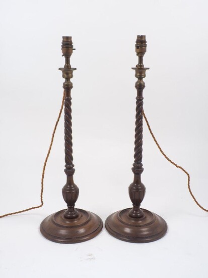 A pair of wood turned table lamps, 20th century, with...