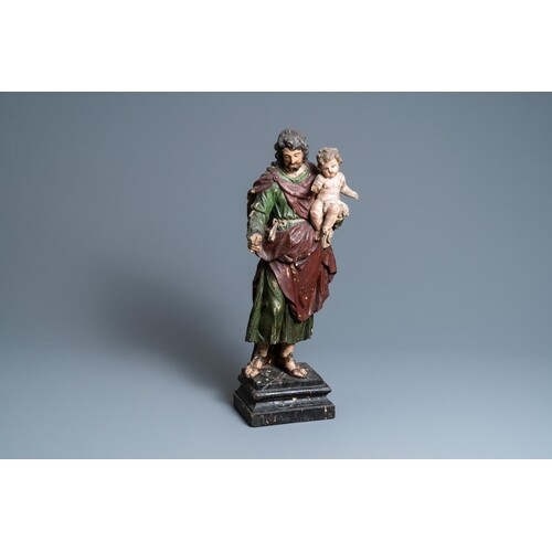 A polychromed wooden figure of Saint Joseph with child, 2nd ...