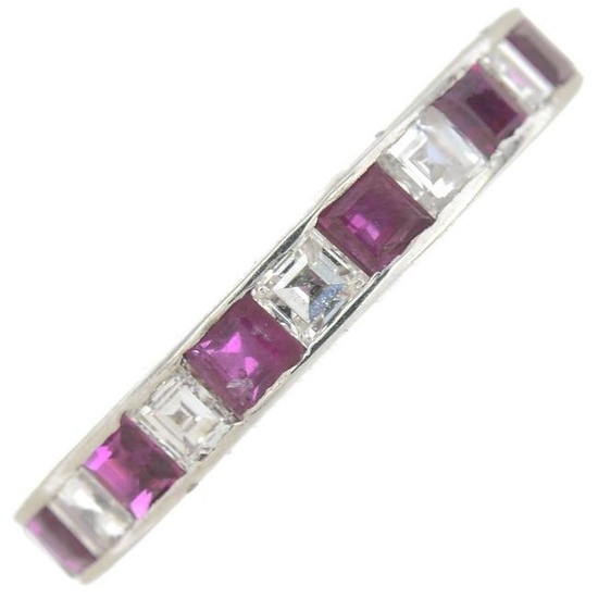 A ruby and diamond full eternity ring. Estimated total