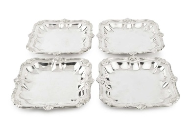 A set of four George III Irish silver serving dishes,...
