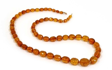A single row graduated faceted cognac amber bead necklace