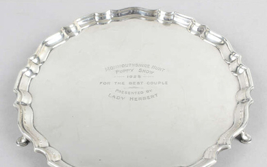 A small Edwardian silver salver with presentation engraving.
