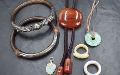A small selection of costume jewellery including two Oriental silver and wood bangles, one having