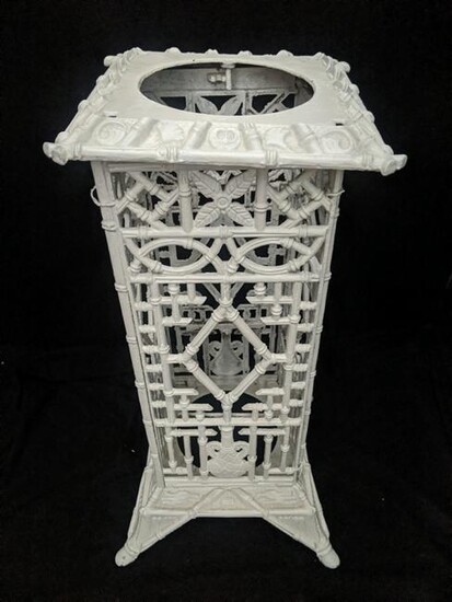 A white painted cast iron umbrella stand, chinoiserie