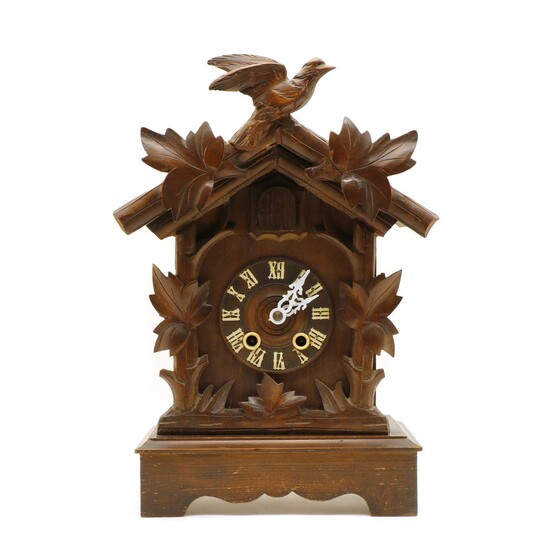 A wooden Black Forest cuckoo clock