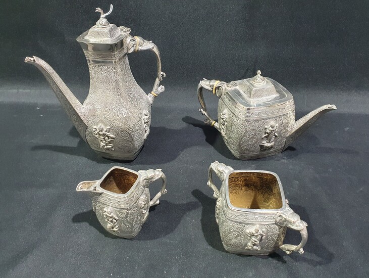 AN EDWARDIAN ANGLO-INDIAN STYLE SILVER PLATED FOUR PIECE TEA & COFFEE SERVICE