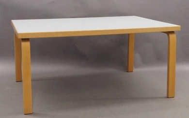 After Alvar Aalto, a children's table, the rectangular white laminate top raised on bent ply birch supports, 57cm high, 120cm wide, 81cm deep