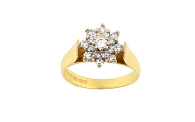 An 18 Carat Gold Diamond Cluster Ring the central raised...