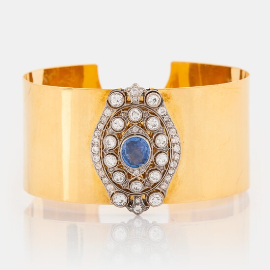 An 18K gold and platinum bracelet set with a faceted sapphire and round brilliant-, eight- and rose-cut diamonds