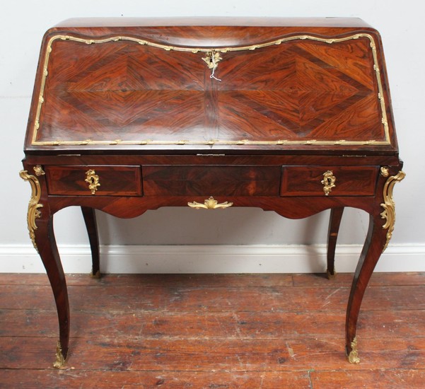 An 18th Century French rosewood and gilt bronze mounted bure...