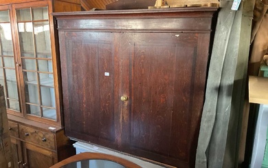 An 18th century oak cupboard with moulded cornice, above two...