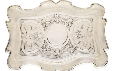 An Art Nouveau Chester silver card tray, Mark of William Neale, Chester 1901, Rd. 376331, Of shaped outline, embossed with sinuous tendrils and irises against a part textured ground, 22.6 cm x 30.7 cm (10.2 oz)