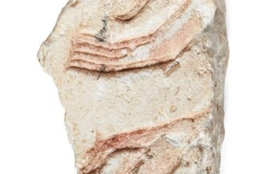 An Egyptian style limestone relief fragment carved with two pairs of hands raised in supplication, pink slip remaining, Not Ancient, 13.5cm x 6.9c, x 6cm Provenance: Formerly in the private collection of Werner Forman (1915-2010)