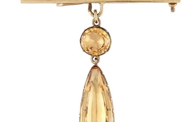 An early 19th century topaz pendant, the pear shaped pale...
