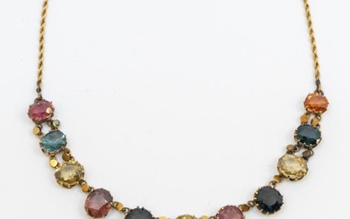 An early 20th century multi-gem harlequin gold set necklace, comprising...