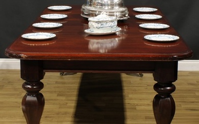 An early Victorian mahogany extending dining table, rounded ...