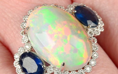 An opal and sapphire three-stone ring, with brilliant-cut diamond surround.
