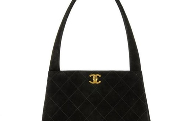 CHANEL - a vintage suede handbag. Featuring a quilted
