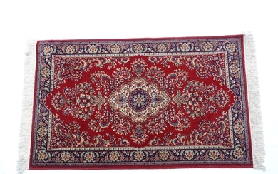 Carpet / Rug : A red ground rug with central cream and blue ...