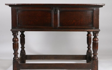 Charles I oak box top or counter table, circa 1640, having a rectangular hinged plank top, above a