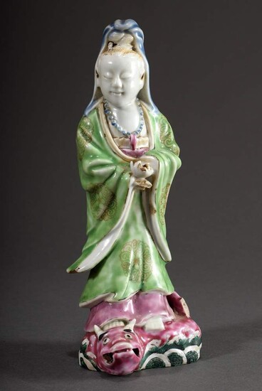 Chinese porcelain figure "Guanyin standing on a mythical creature", colourfully painted, end of 19th century, h. 21cm, somewhat defect, crack