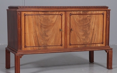 Danish cabinetmaker: A small mahogany sideboard, front with two doors, profiled legs. H. 74 cm. W. 116 cm. D. 50 cm.
