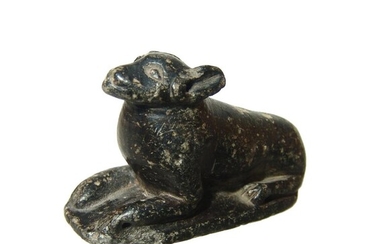 Egyptian serpentine figure of a recumbent dog