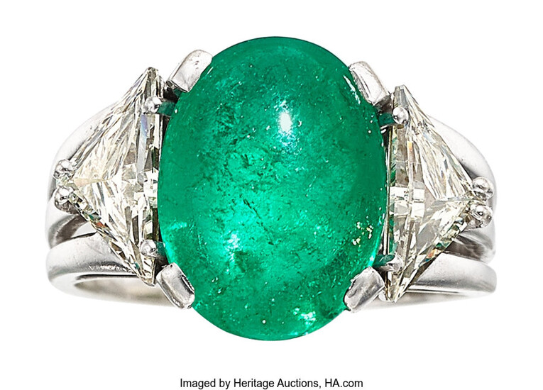 Emerald, Diamond, White Gold Ring The ring features an...