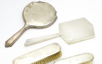 Four assorted silver backed dressing table items to include ...